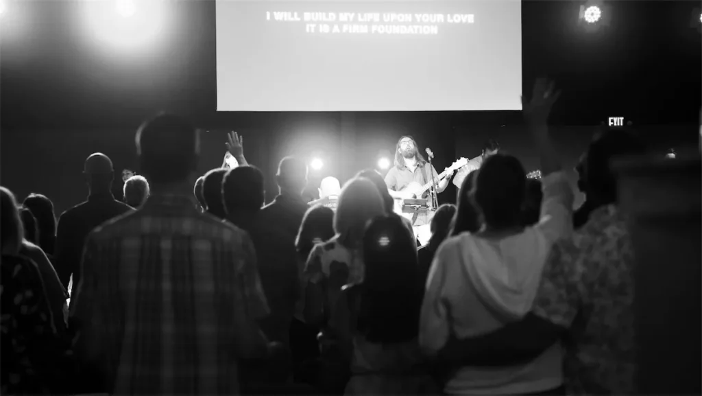 People worshiping with hands raised